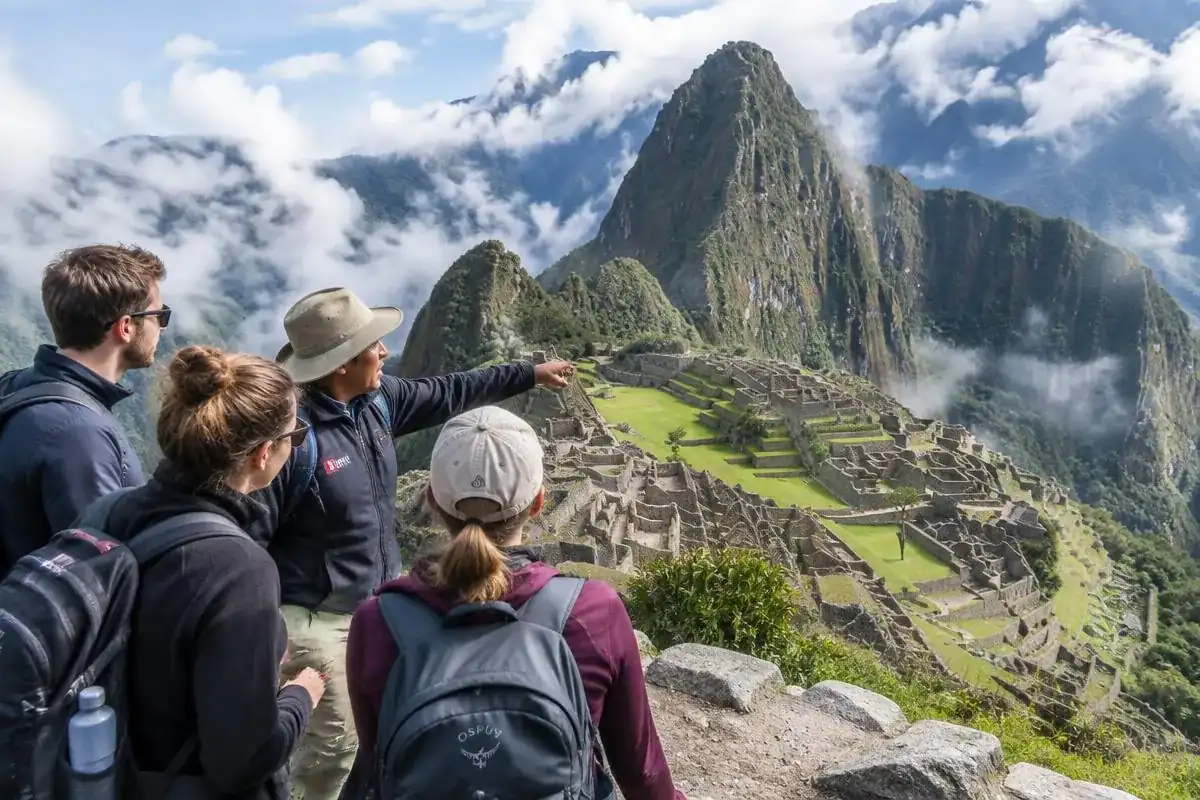 Licensed guide explaining Inca stonework to a small group after the Machu Picchu ticket check