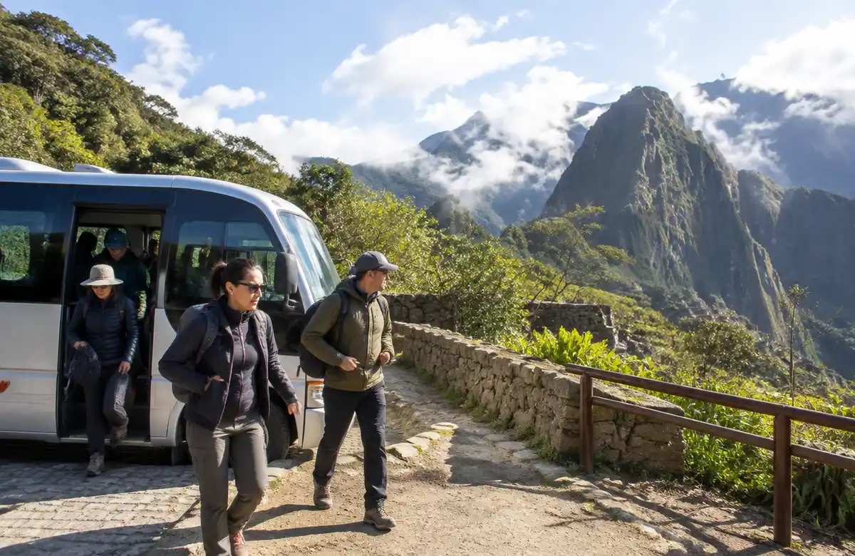 Visitors stepping off the shuttle bus at the Machu Picchu entrance area