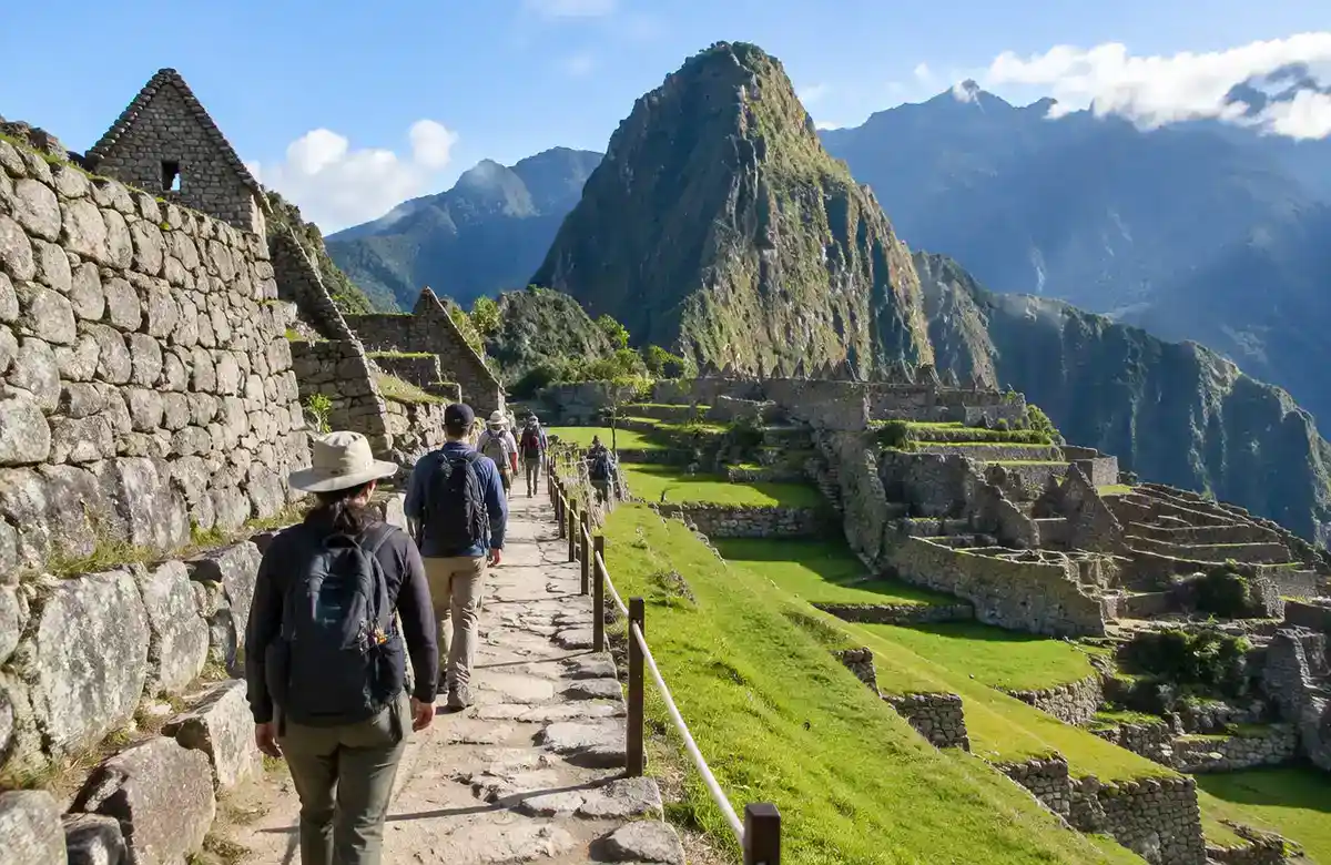 Visitors walking a roped one-way stone path on a Machu Picchu circuit
