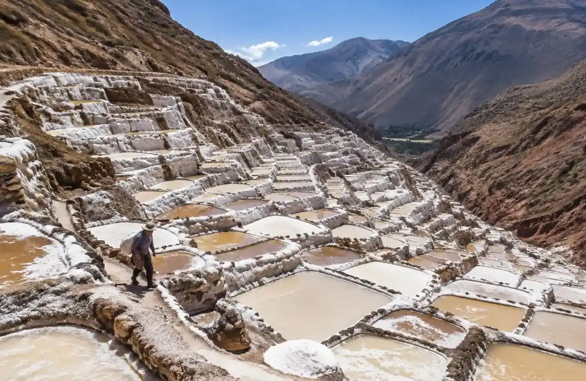 Maras salt mines with thousands of terraced white salt pools on a Sacred Valley hillside
