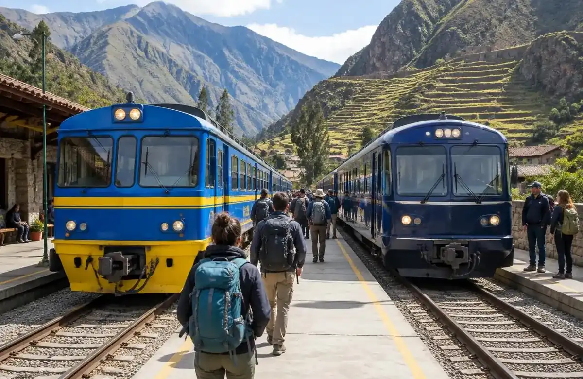 Two tourist trains side by side at Ollantaytambo station comparing PeruRail and Inca Rail
