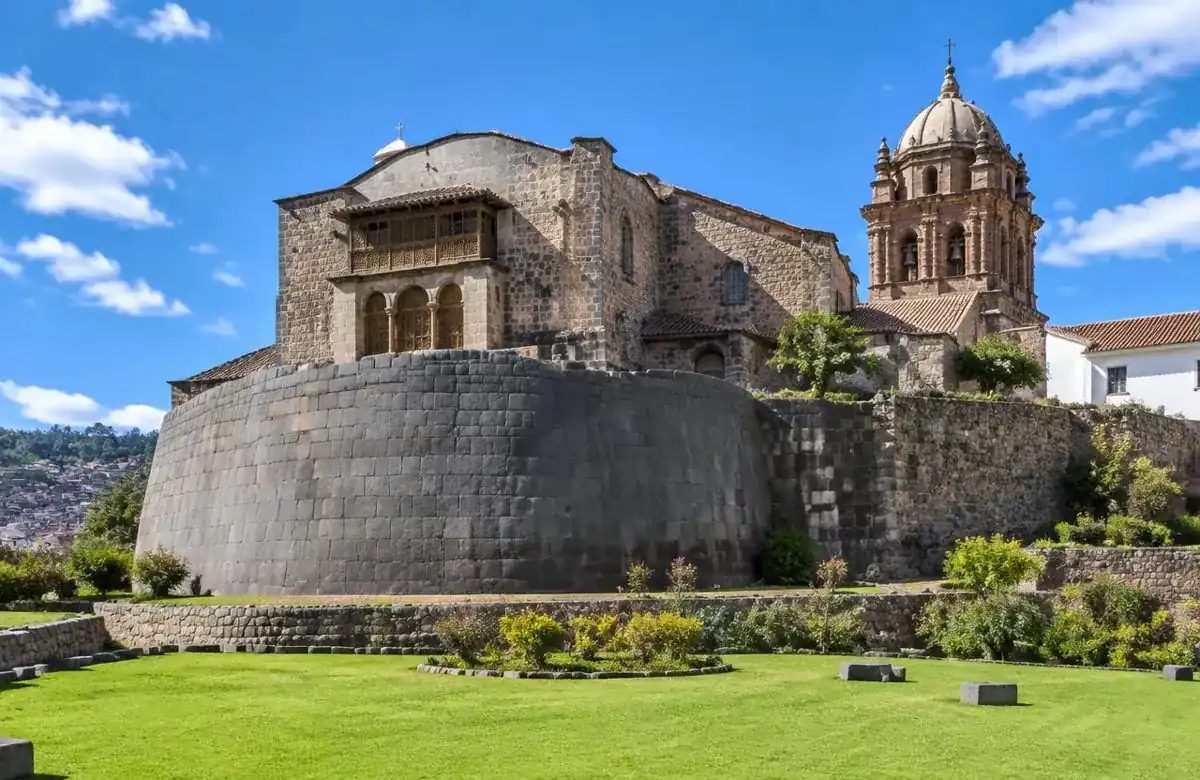 Qorikancha curved Inca stone wall beneath the colonial Santo Domingo church in Cusco