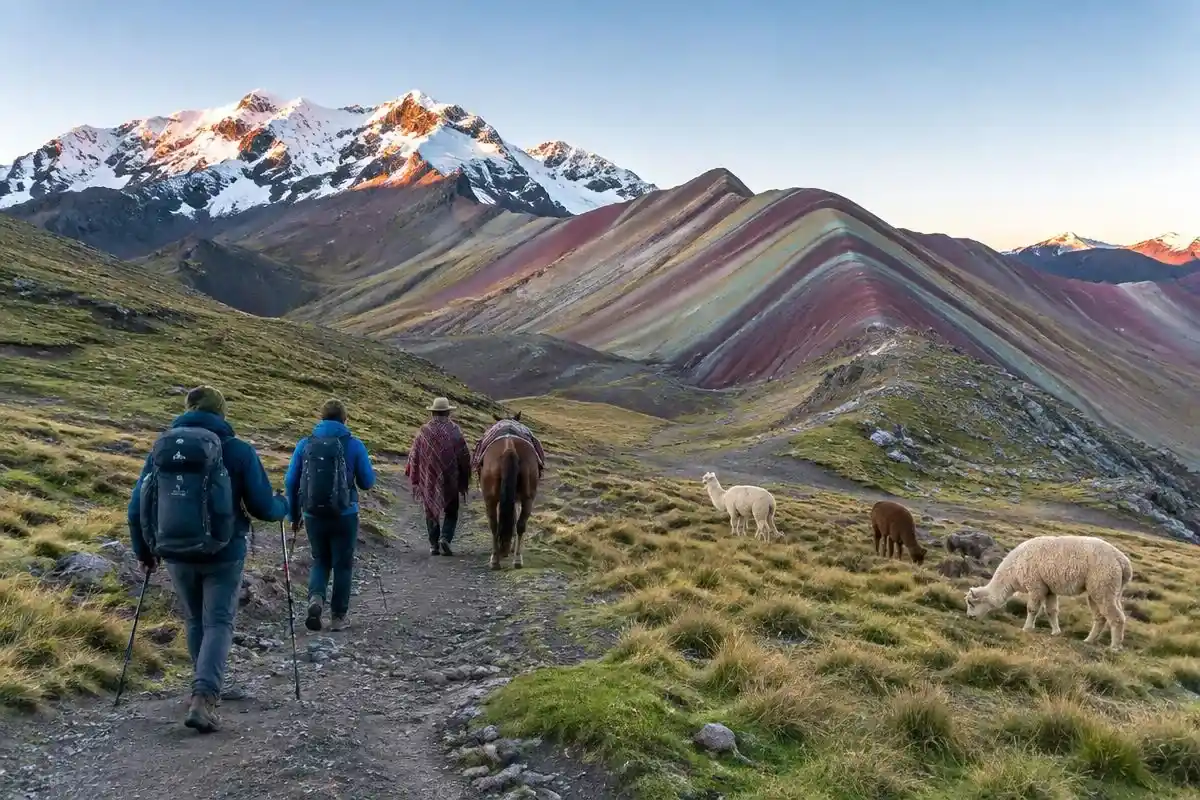 Hikers and a local horse on the trail during a Rainbow Mountain tour at dawn